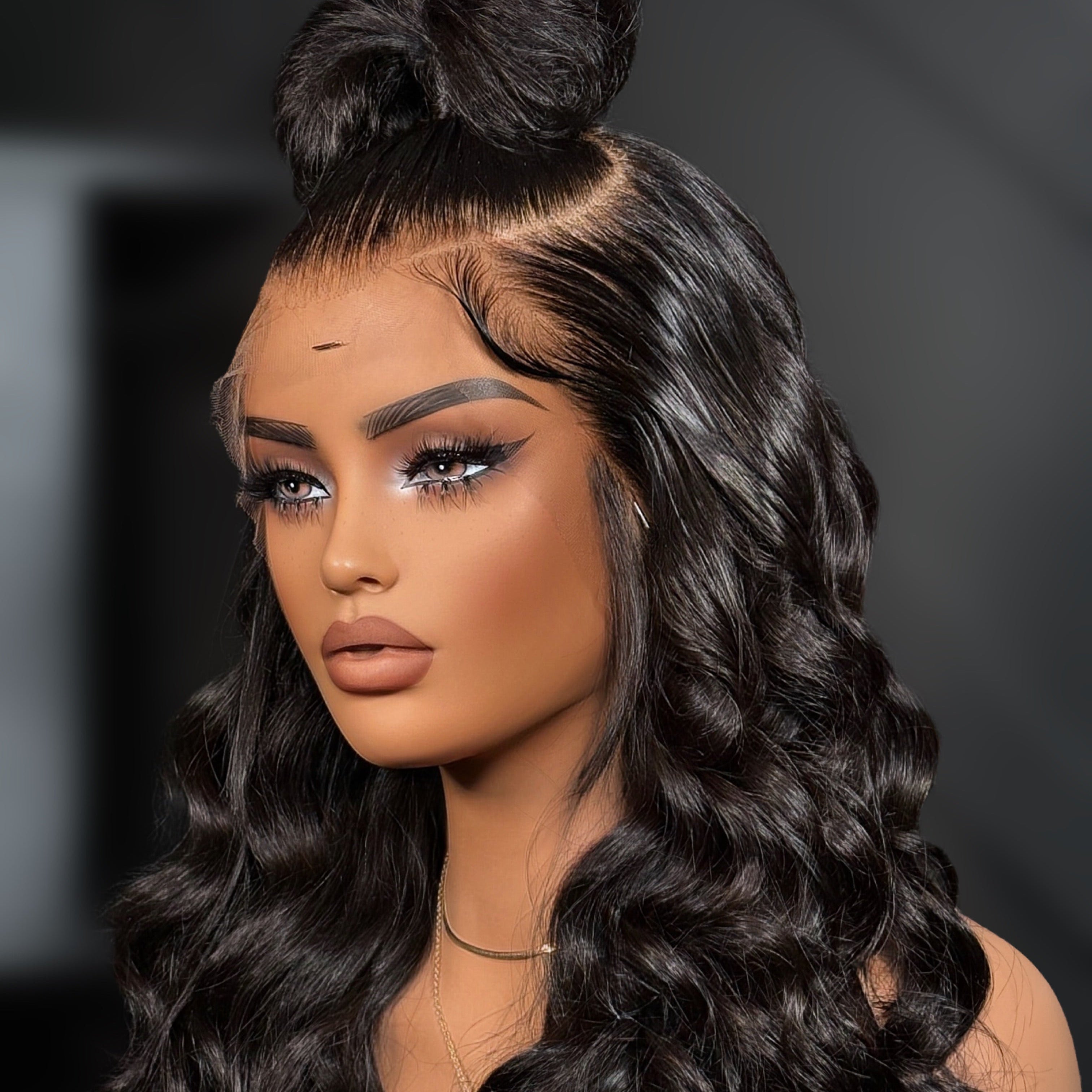 Woman with styled hair on a dark background